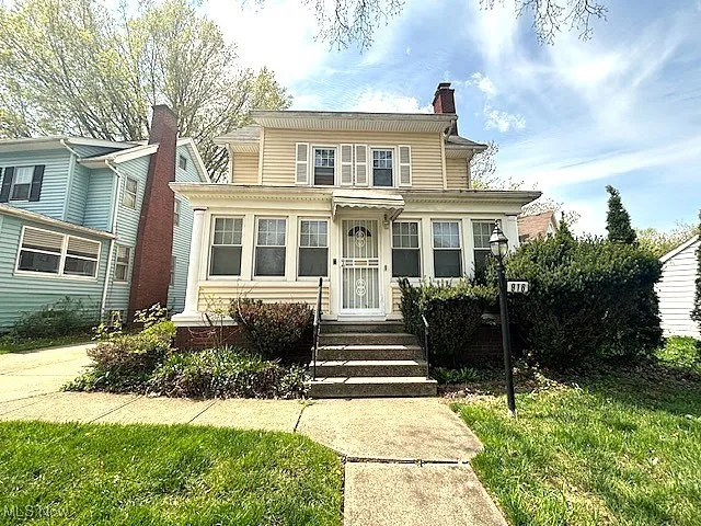 View of front of home with a chimney