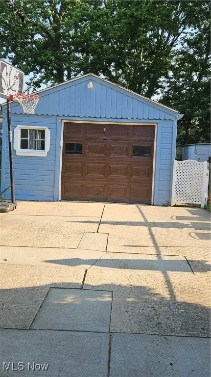 Garage with concrete driveway