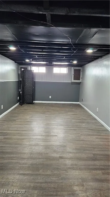 Below grade area featuring wood finished floors