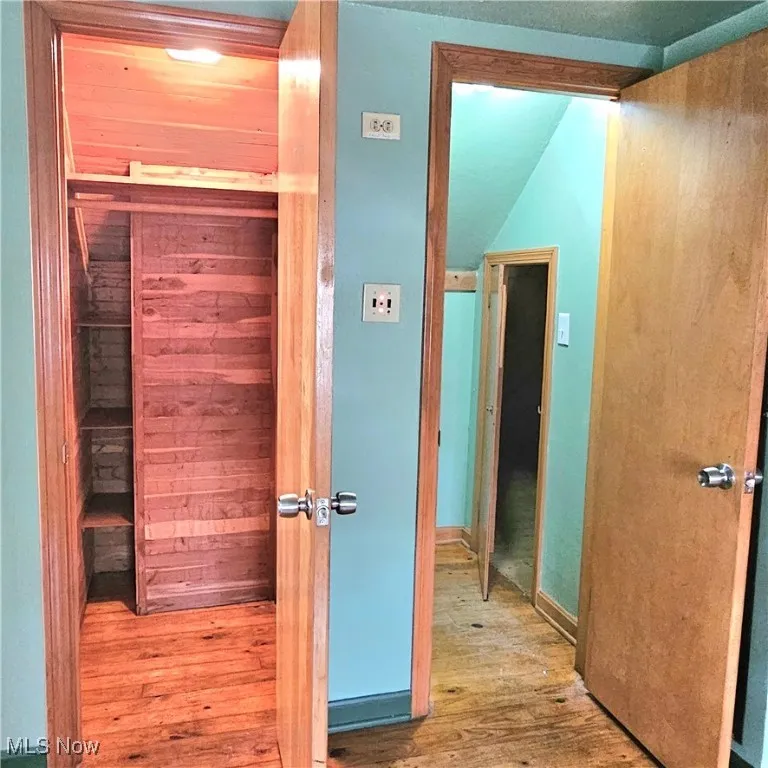 Hall with wood finished floors