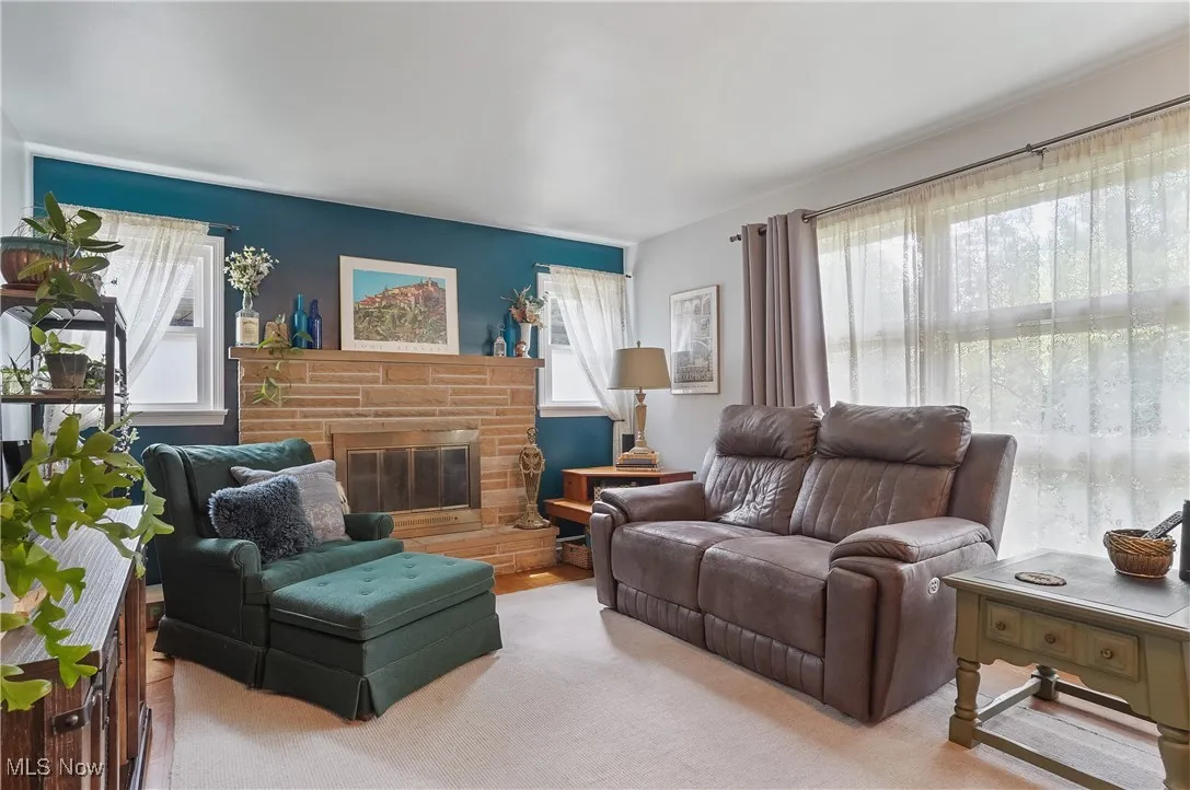 Living area with a brick fireplace