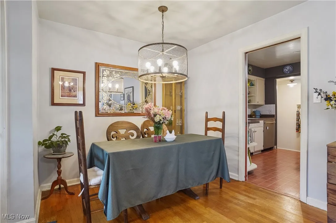 Dining area featuring a chandelier and wood finished floors