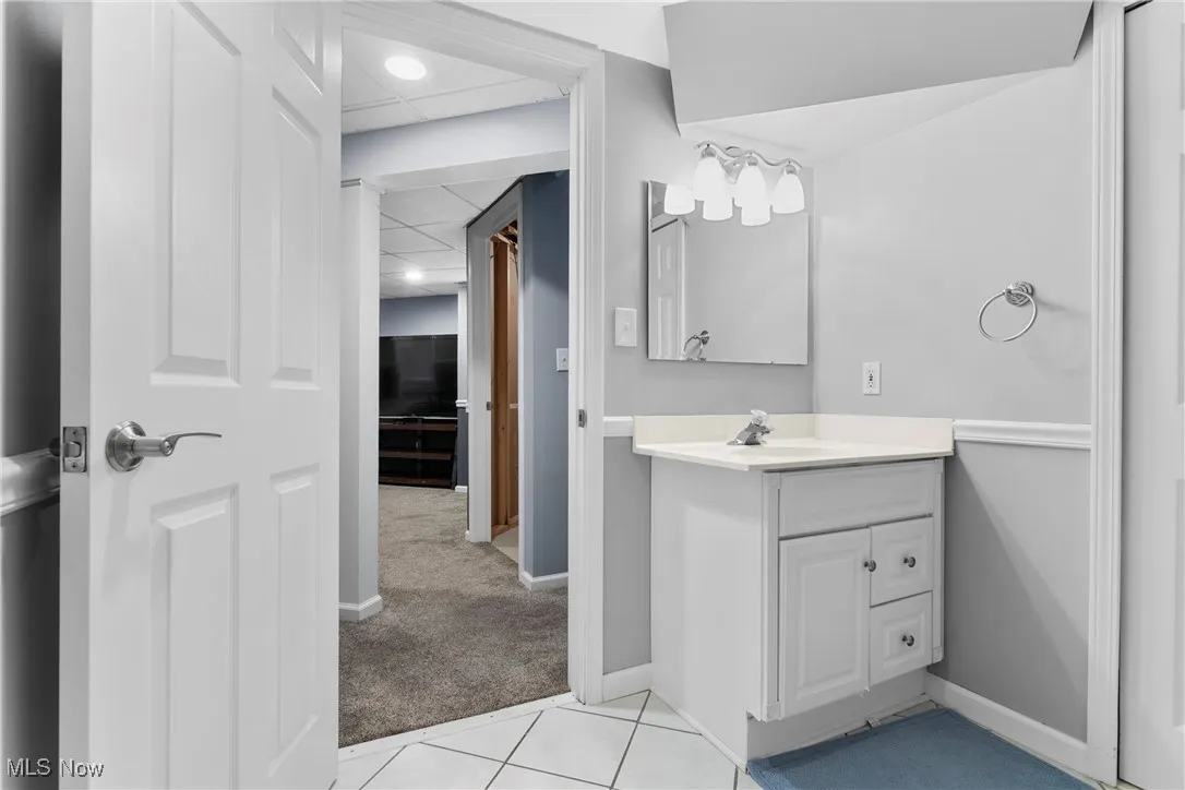 Bathroom with vanity and recessed lighting