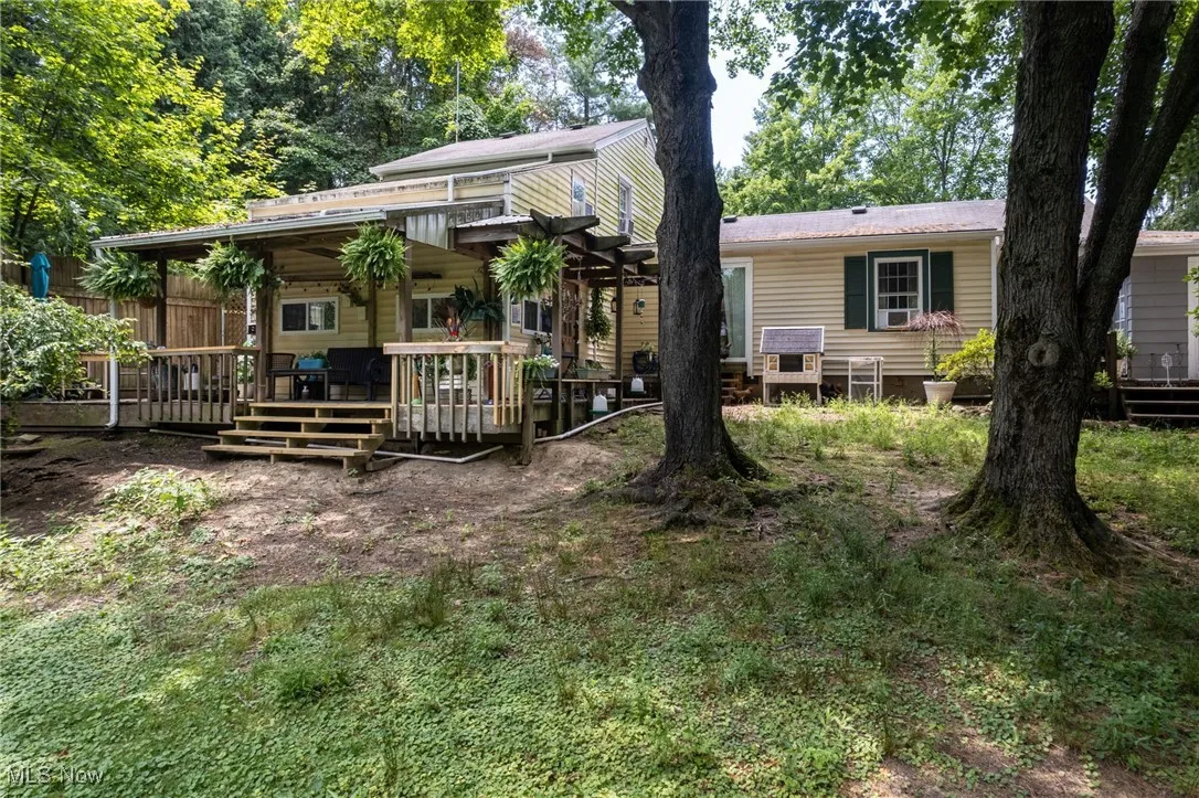 Back of property with a deck