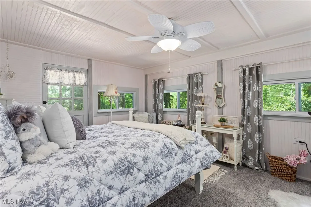 Bedroom with carpet flooring and a ceiling fan
