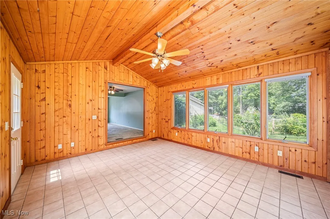 Unfurnished sunroom featuring healthy amount of natural light