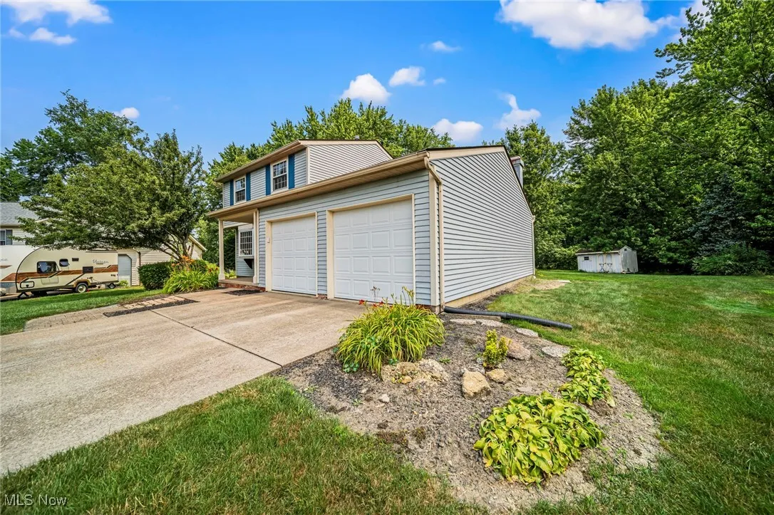 Garage with concrete driveway