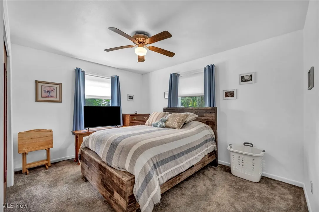 Bedroom with carpet floors and ceiling fan