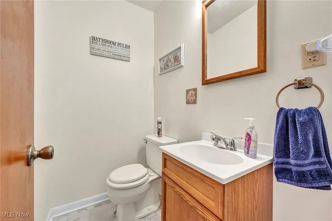 Bathroom featuring vanity and toilet