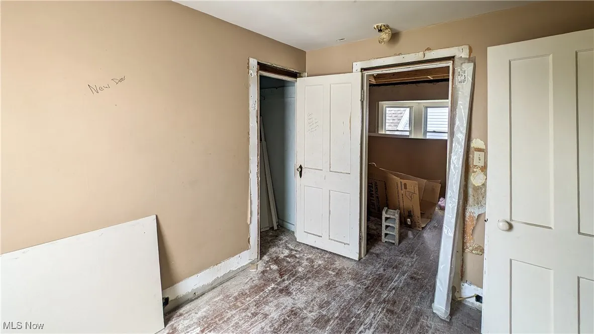 Bedroom with wood finished floors