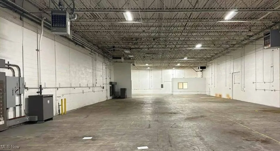 Garage featuring a heating unit