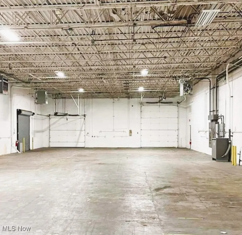 Garage featuring a heating unit