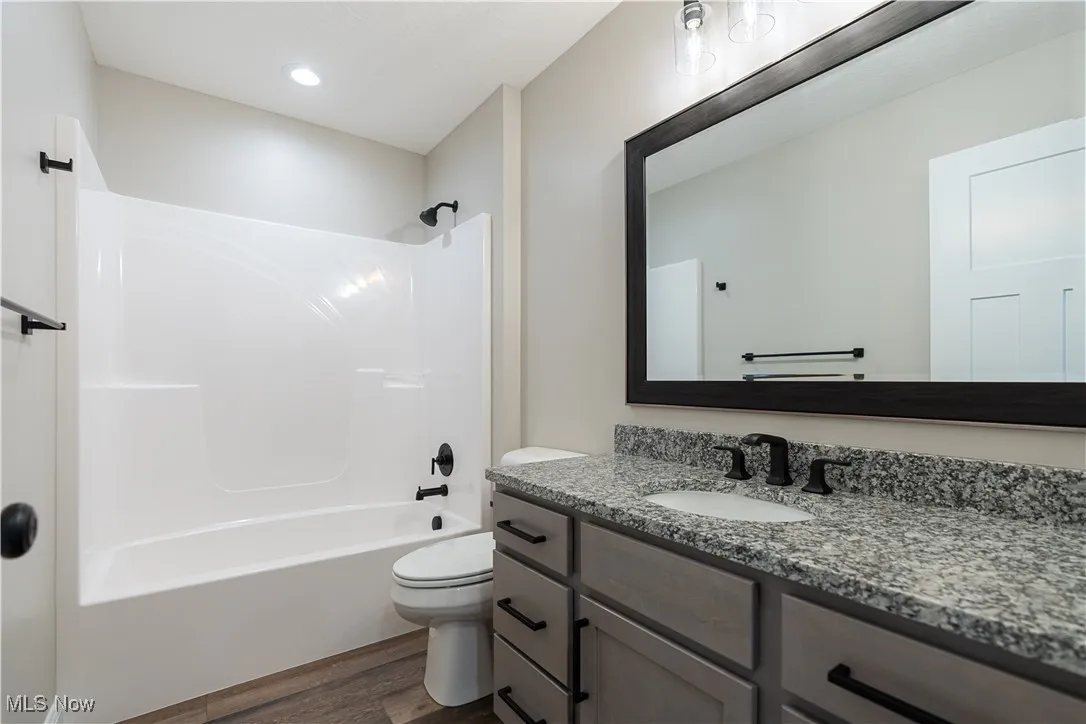 Full bathroom with vanity and bathtub / shower combination
