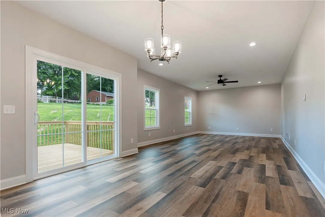 Large great room off the kitchen with patio doors to the deck out back.