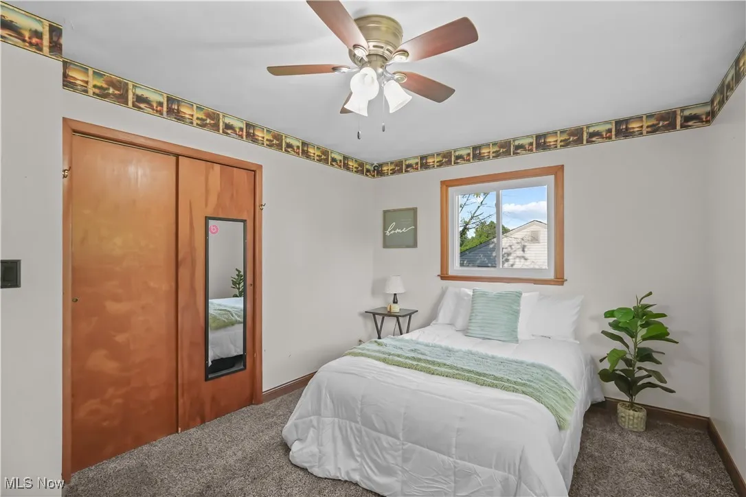 Bedroom featuring carpet flooring and a ceiling fan