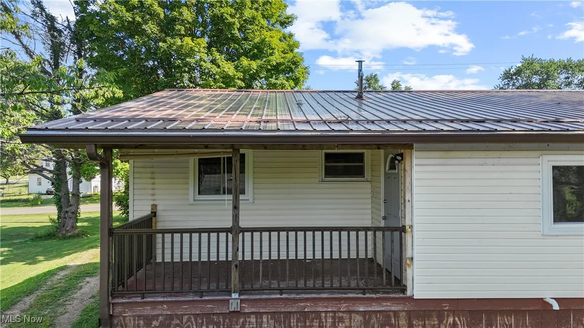 Rear view of house with a metal roof