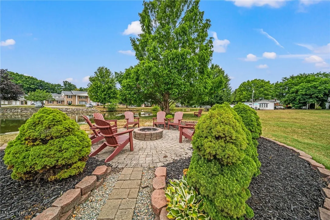 View of patio featuring an outdoor fire pit