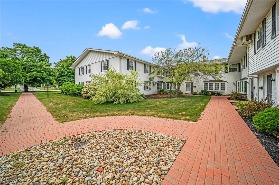 View of property's community featuring a lawn