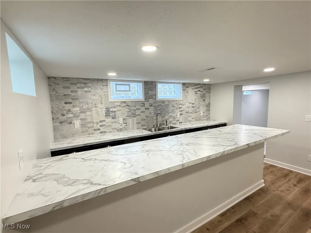 Bar with recessed lighting and dark wood finished floors