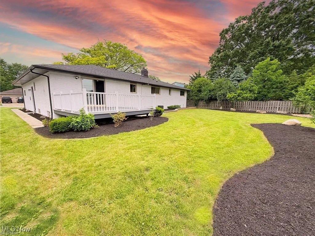 View of yard with a wooden deck
