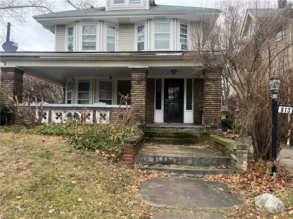 Doorway to property with covered porch