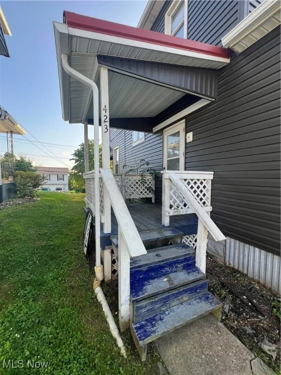Wooden deck featuring a yard