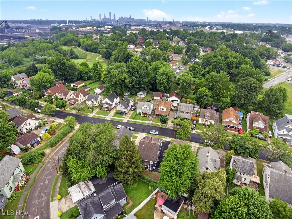 Aerial overview of property's location featuring nearby suburban area