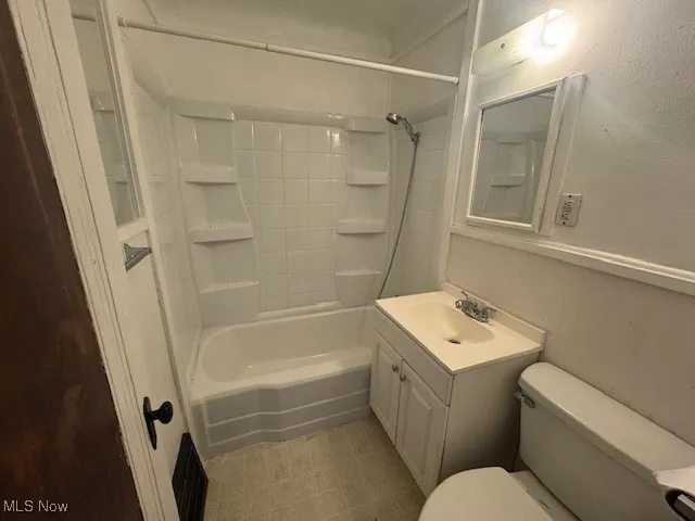 Bathroom featuring vanity and shower / bath combination