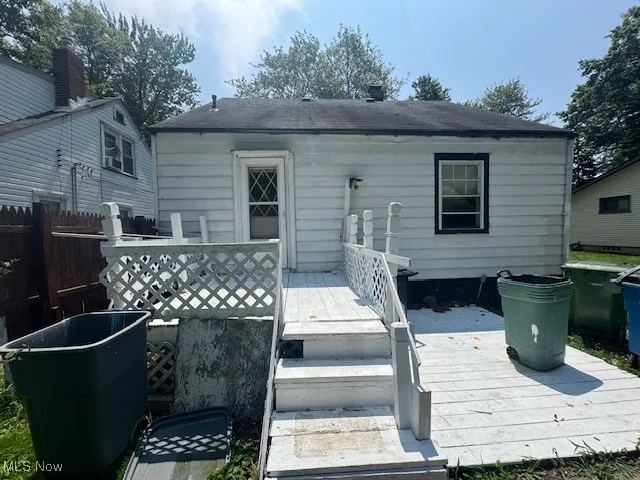 Rear view of property featuring a wooden deck