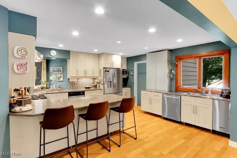 Kitchen with breakfast bar. Caesarstone quartz counters.