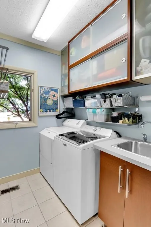 First floor laundry with sink and added storage.