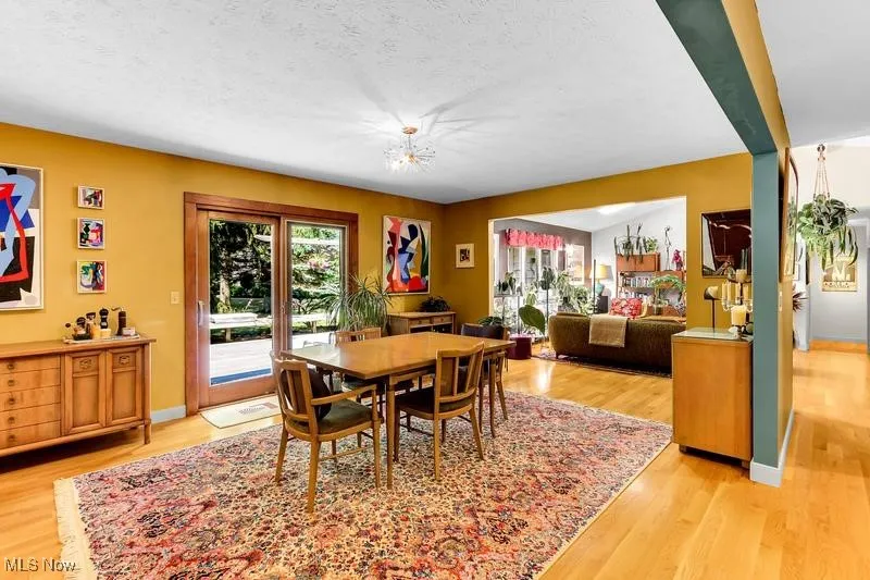 Dining room accesses an expansive deck running across the back of the house.