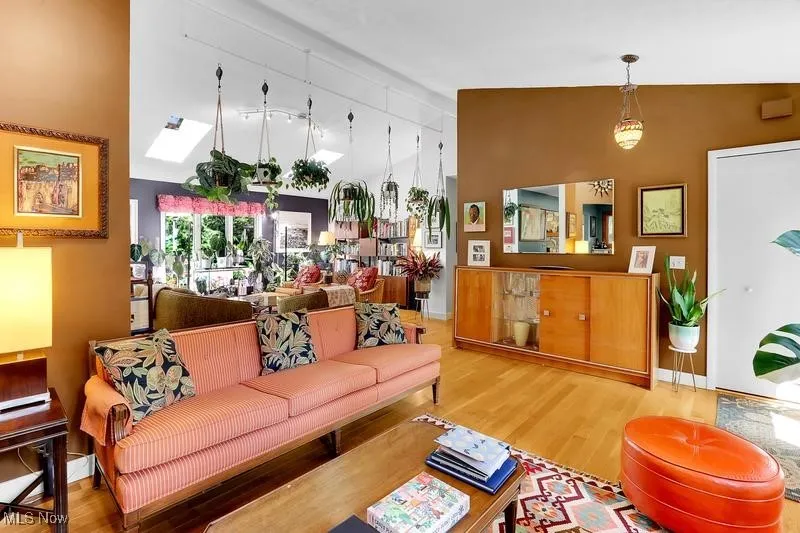 Sections of walls were removed to open up the living room but certainly can be replaced if a more traditional plan is desired.