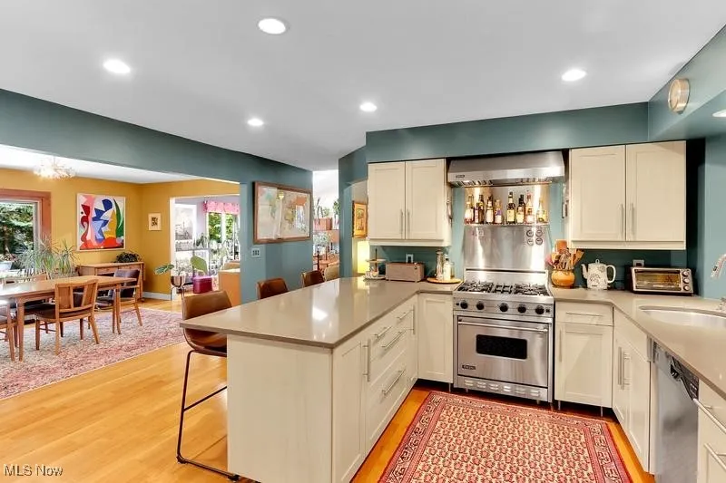 Kitchen with upgraded stainless appliances & Caesarstone counters.