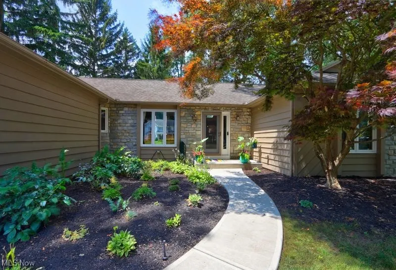 Newer concrete driveway & inviting walk to front door.