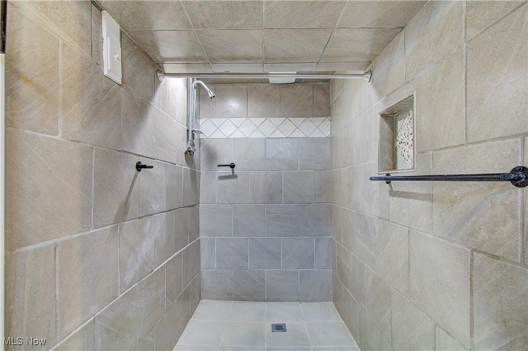 Newly tiled shower in basement view 2.