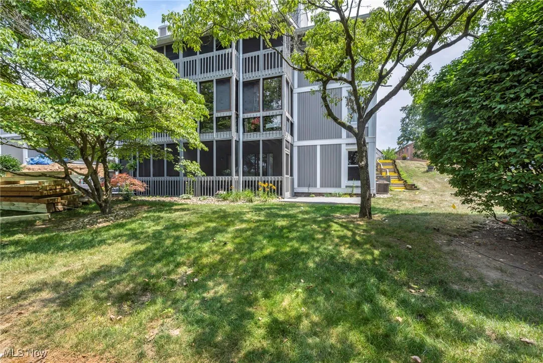 Back of house with a lawn