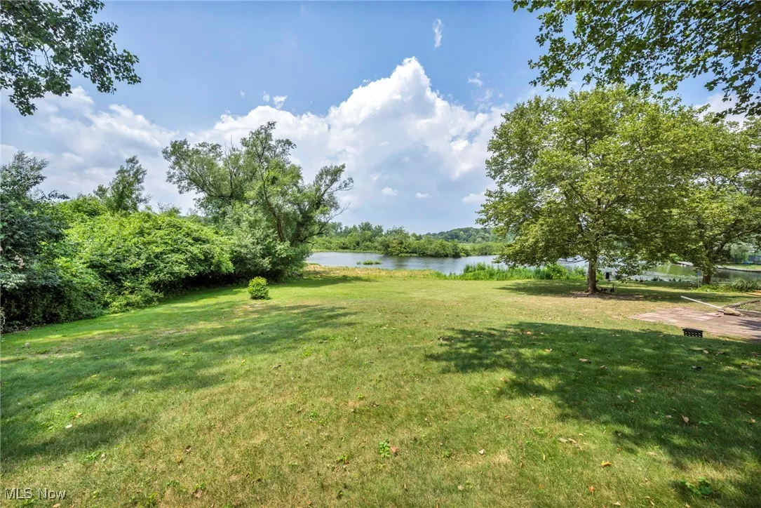 View of green lawn with a water view