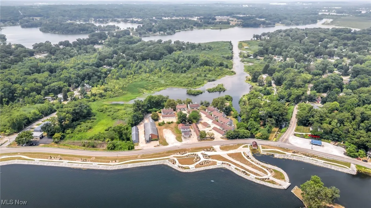 Aerial view of property's location with a nearby body of water