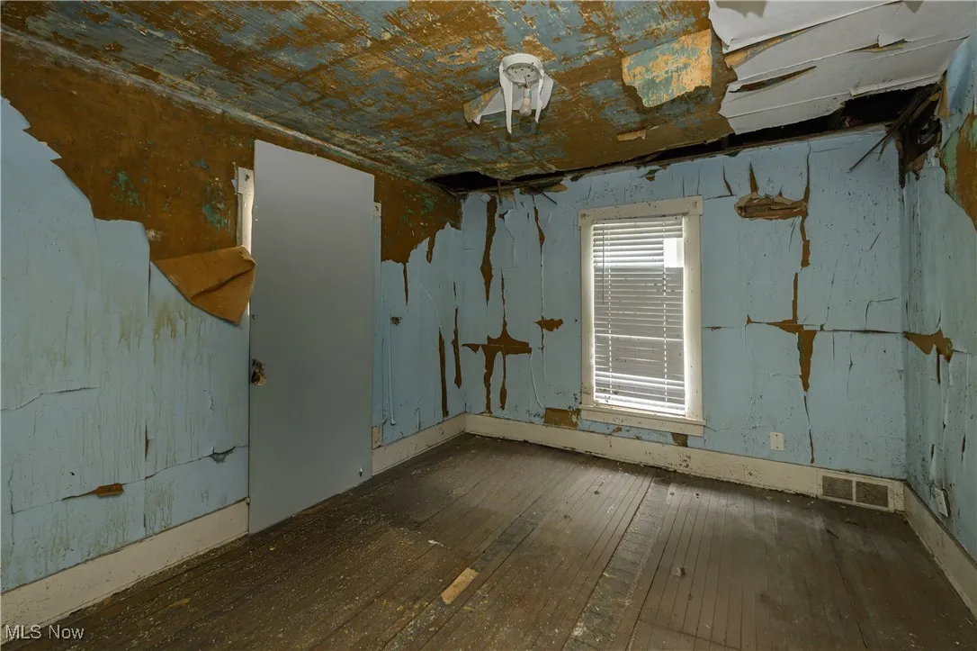 Unfurnished room featuring hardwood / wood-style flooring