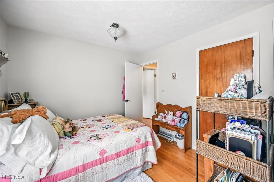 Bedroom with wood finished floors