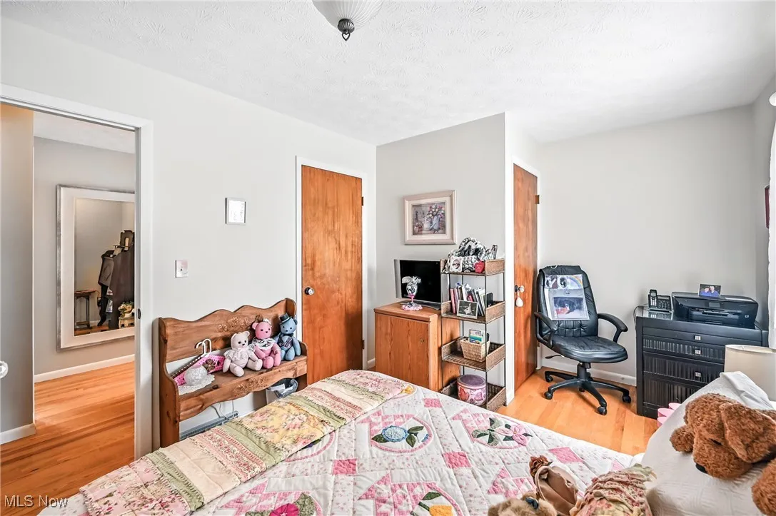 Bedroom with wood finished floors
