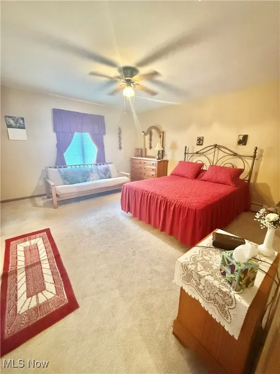 Bedroom featuring carpet floors and ceiling fan