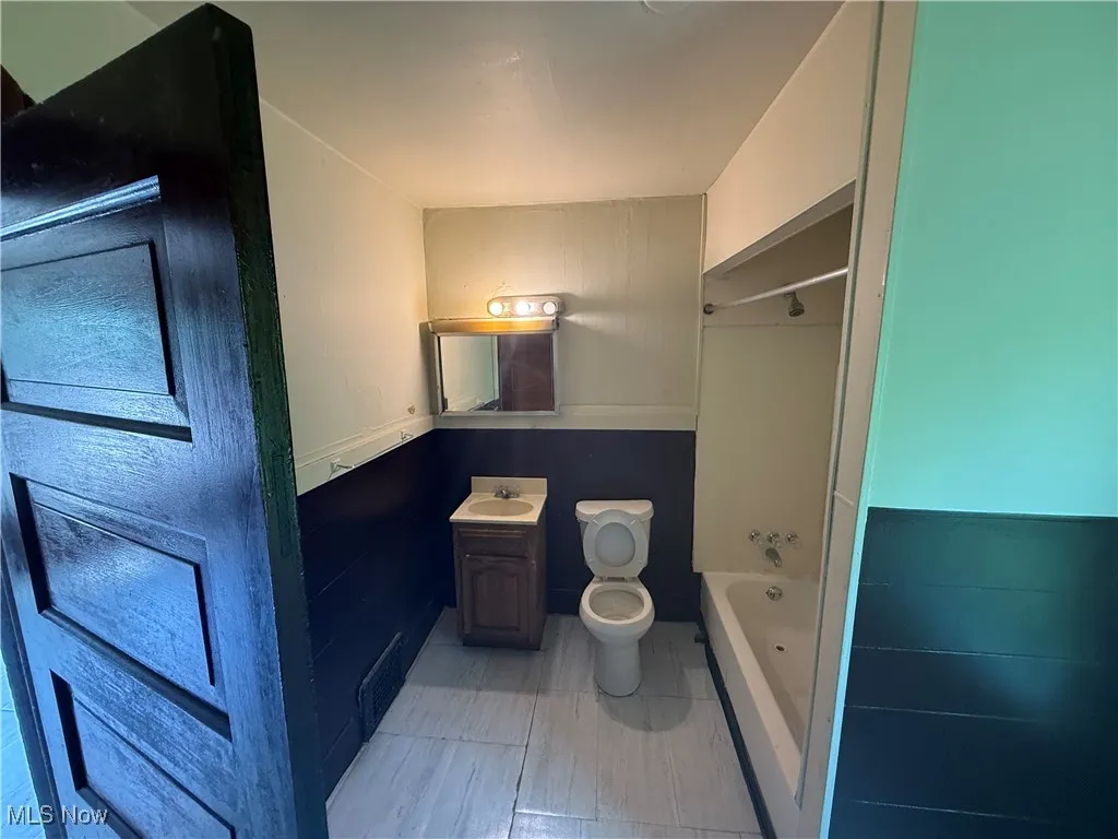 Full bathroom with vanity and shower / bath combination