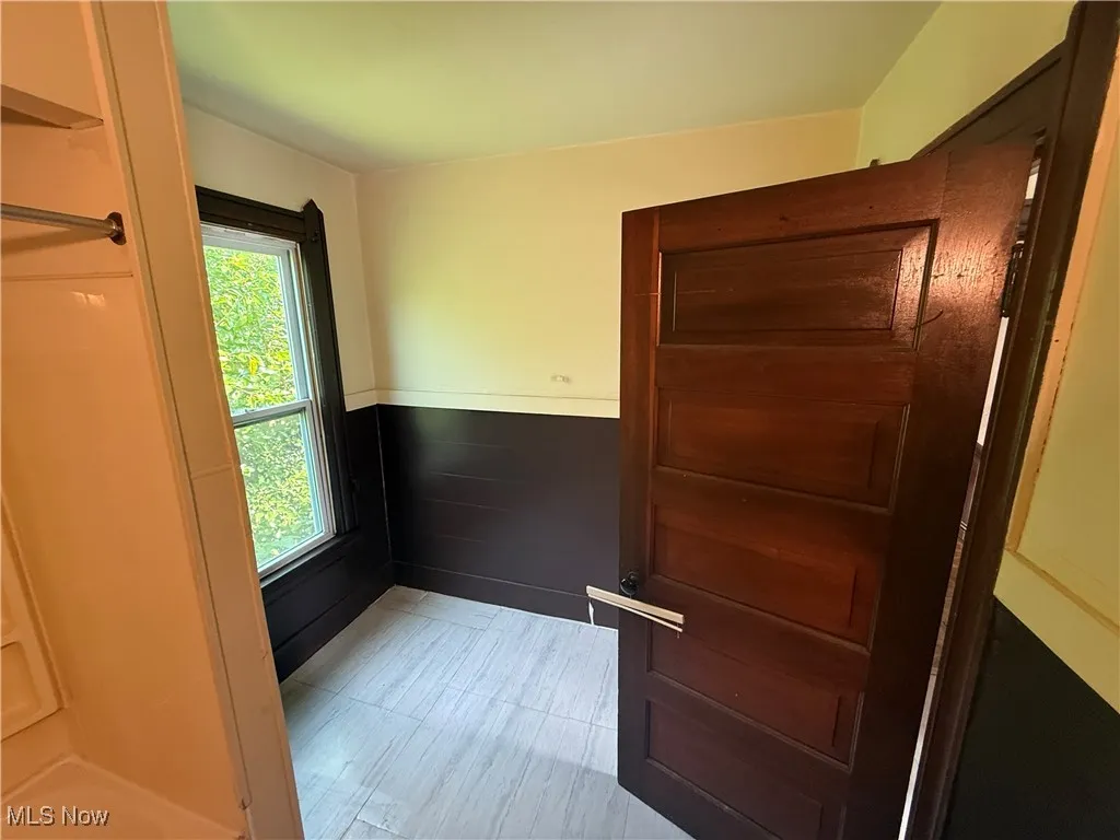 Entryway with a wainscoted wall