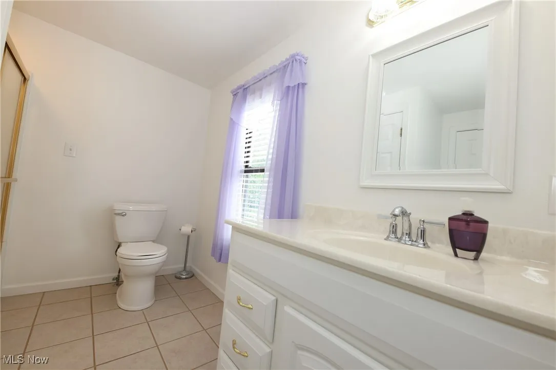 Bathroom featuring vanity and tile patterned floors