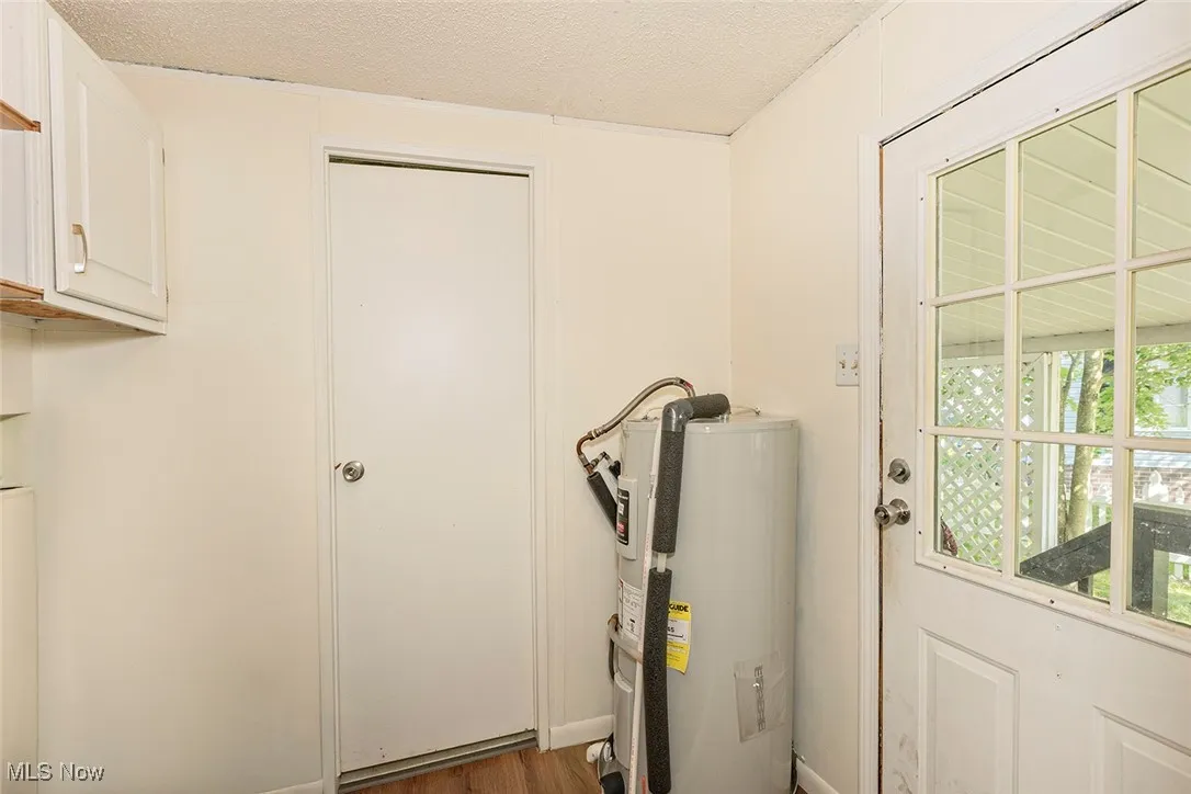 Utility room with electric water heater