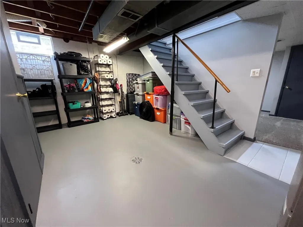 Below grade area featuring stairs