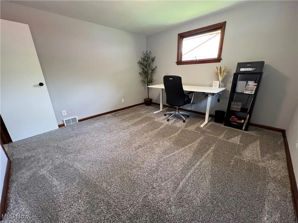Office featuring carpet flooring and baseboards