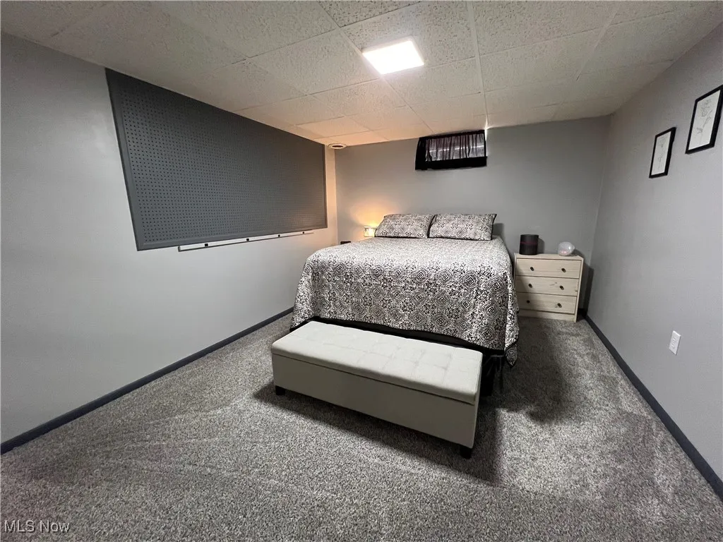 Bedroom with carpet and baseboards